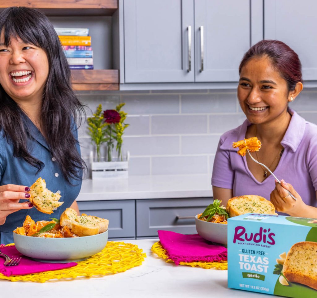 Friends sharing laughs over Rudi's Texas Toast